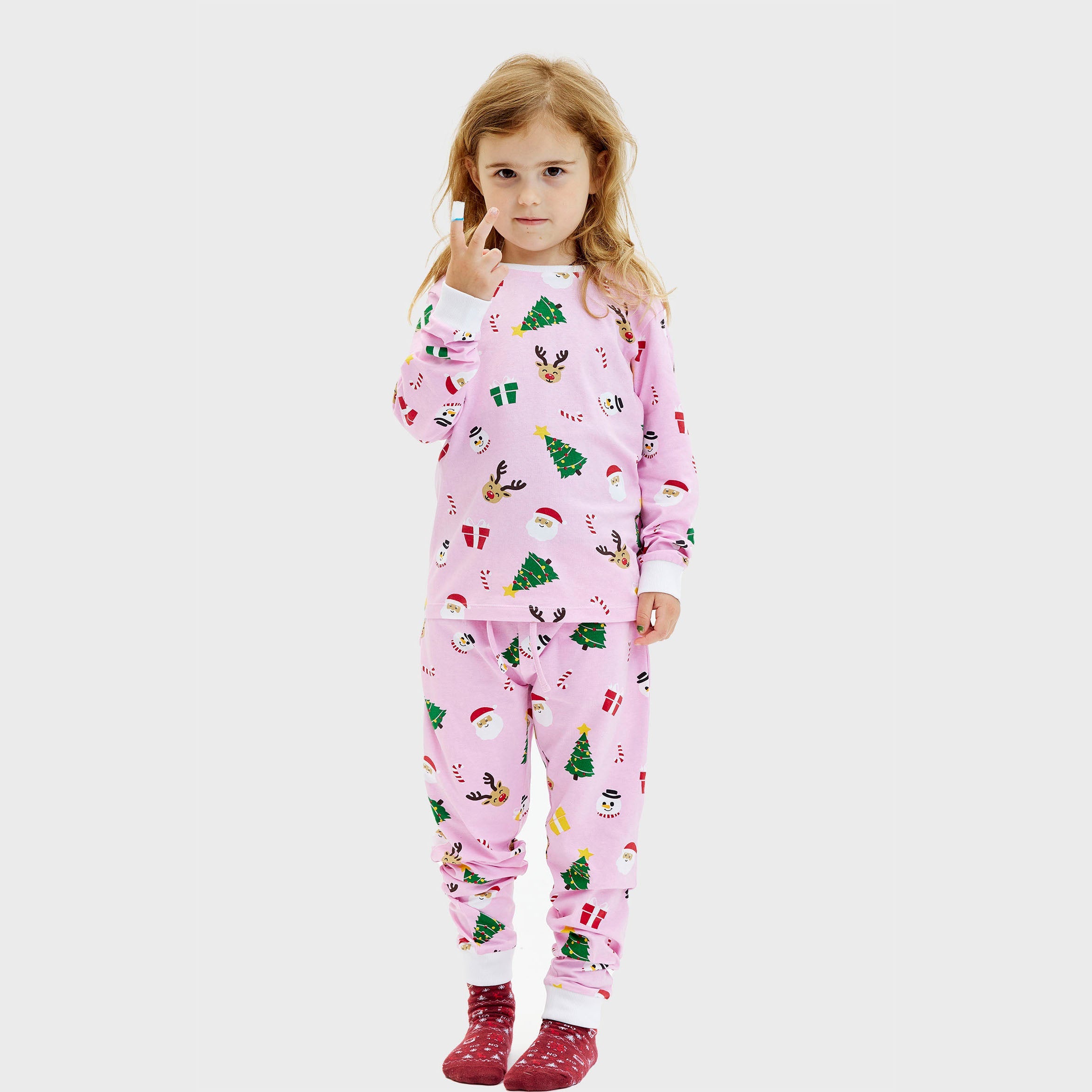 Kinder-Weihnachtspyjama in Rosa mit bunten Weihnachtsmotiven, langärmelig und langbeinig, weihnachtspullover damen Stil.